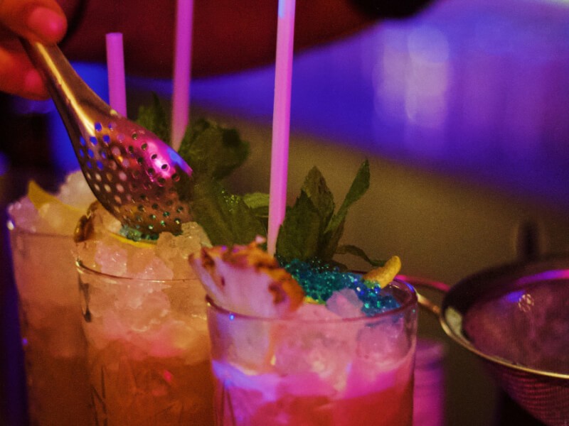 mixing drinks at a cocktail class in manchester